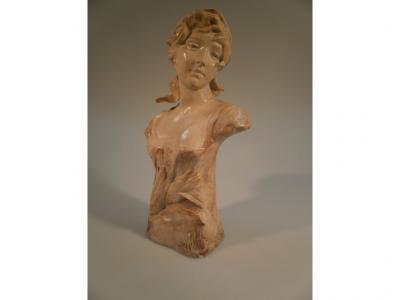 An early 20thC pottery bust of a young woman