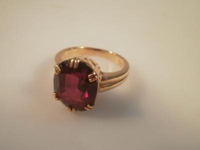 A dress ring set with a synthetic spinel to shank stamped 18K