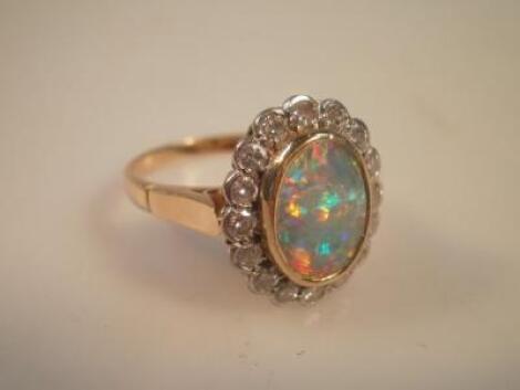 An oval opal 10mm x 7mm dress ring