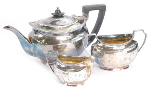 An Edwardian silver three piece bachelors tea service, comprising teapot, 12cm high, two handled sugar bowl and milk jug, each with angular handles and plain boat shaped bodies, Sheffield 1902, 23½oz all in. (3)