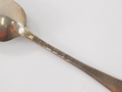 A pair of George III silver teaspoons, shell capped fiddle pattern, Newcastle 1803, 13cm wide, another similar, a London Britannia silver and a silver tablespoon, 5oz. (a quantity) - 2