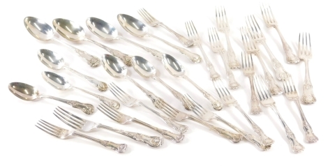 A George IV silver part canteen, shell capped, kings pattern, comprising six settings of spoons, entree forks, dinner forks, four serving spoons, various dates, mainly London 1824, 66oz.