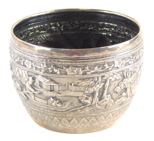 A Chinese export silver bowl, by Wang Hing, repousse decorated with raised figures and buildings, with an upper and lower geometric banding, impressed marks, W.H. 90 beneath, 7cm high, 4.5oz.