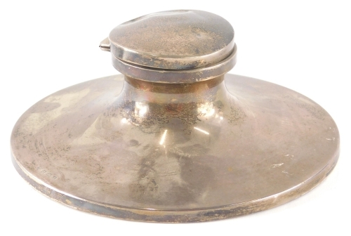 A George V silver Capstan inkwell, of large proportion, the plain circular body on a weighted base, Birmingham 1925, 19cm diameter, 23oz all in.