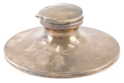 A George V silver Capstan inkwell, of large proportion, the plain circular body on a weighted base, Birmingham 1925, 19cm diameter, 23oz all in.