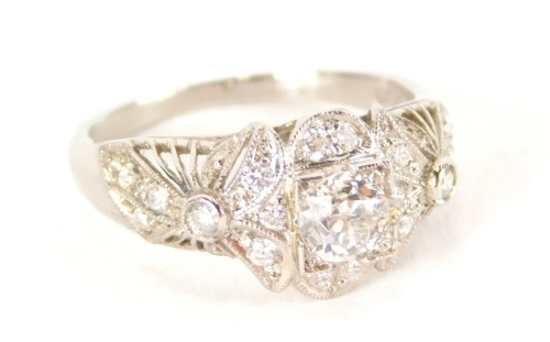 A ladies diamond cluster ring, c1920's with a central rose cut diamond, approximately 0.40ct, surrounded by 18 rose cut diamonds, set in a detailed crown with millegrain edges, total diamond weight approximately 0.76ct, stamped PL18, tests as platinum, 3.