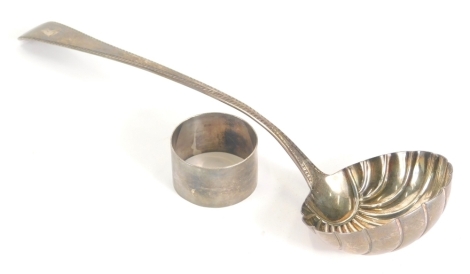 A George III silver ladle, by Richard Crossley, old English pattern, shell bowl, London 1802, 29cm long, 3.7oz. and a plain silver napkin ring. (2)