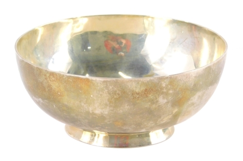 A 20thC sterling silver bowl, marked I.G, of plain circular form on circular foot, marked (S)TERLING, HANDWROUGHT, THORP, probably American, 9cm dia.