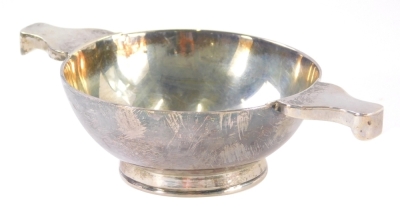 A George III Scottish silver quaich by William & John Taylor, of plain circular form with shaped handles, on a circular foot, Edinburgh, 1776, 14cm wide, 3.5 oz.