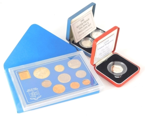 A silver proof two coin 10 pence coin set, an Isle Of Man decimal coin set and an Anniversary of the EEC 50 pence proof coin. (3 cased)