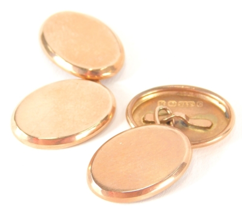 A pair of 9ct gold cufflinks, each of plain oval form with chain centres, 3.5g.