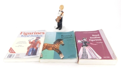 A Royal Doulton Childhood Days figure, I'm Nearly Ready, HN2976, printed marks beneath, 18cm high, and three reference books on Doulton figures, etc. (4)