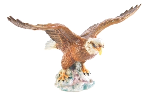 A Beswick bald eagle, 1018 impressed marks beneath, 21cm high. (AF)