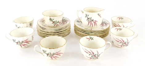 A Royal Worcester Dunrobin part tea service, to include milk jug, 8cm high, cups, side plates and saucers, printed marks beneath (part settings for seven) (AF).