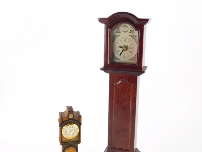 A 20thC miniature longcase clock, in mahogany finish case, Tempus Fugit type, 40cm high, and another smaller. (2) - 2