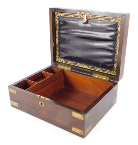 A 19thC rosewood travelling stationery box, with brass mounts and part fitted interior with vacant cartouche.