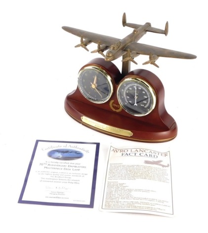 A Bradford Exchange 70th anniversary Lancaster Bomber clock, in original packaging, marked beneath, 15cm high.