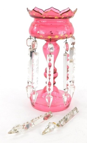 A Victorian single ruby glass lustre, with gilt highlights, 28cm high, and plain droppers. (AF)