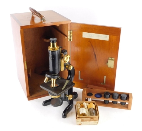 An Agents Redfern Sheffield service microscope, marked W Watson & Sons, in fitted case, 38cm high.