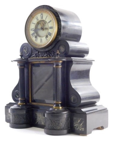 A Victorian black marble mantel clock, the elaborate case with a 13cm diameter Roman Numeric dial with partial visible movement, raised above columns, on a rectangular base set with marble sections, with 8 day movement, 48cm high.