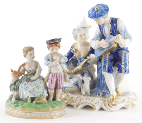 A mid 20thC Dresden porcelain figure group of children, polychrome decorated with gilt highlights, 14cm high, and a further continental figure group of musicians. (2)