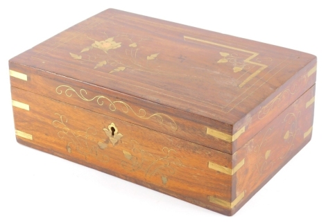 An Eastern hardwood jewellery casket, of rectangular form with gilt highlights and fitted interior, 12cm high, 31cm wide, 22cm deep.