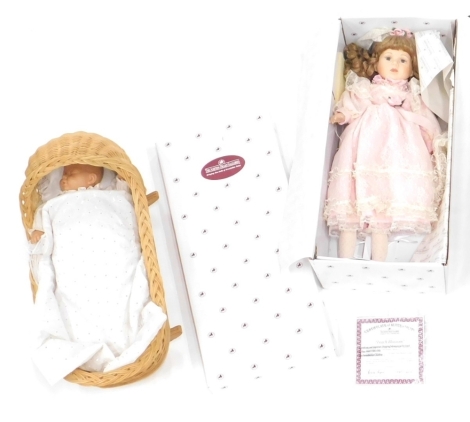 An Aston Drake doll, 55cm high, further doll, wicker cradle, etc. (partially boxed, a quantity).