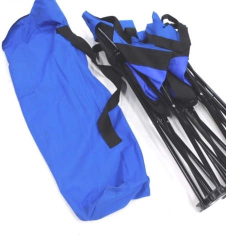 A folding camp bed in blue, with outer canvas carrier, 95cm high.