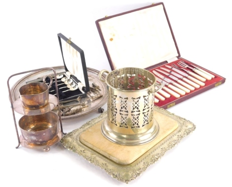 Various silver plated ware, bottle coaster of cylindrical part pierced form, 14cm high, nibs, milk warmer, mother of pearl handled knives, etc. (a quantity).