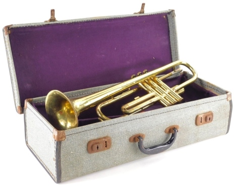 A Lignal brass trumpet with three buttons, 48cm wide in a fitted case.