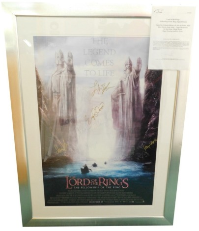 A Lord of the Rings The Fellowship of The Ring printed film poster, bearing signatures Orlando Bloom, Sir Ian McKellen, Elijah Wood, etc., glazed, mounted and framed with certificate of authenticity.