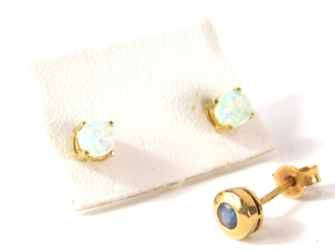 A pair of opal earstuds, claw set, unmarked (2)