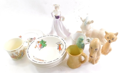 A Coalport Ladies of Fashion figure, Demetria, printed marks beneath, 23cm high, various other items, Sugar Puffs advertising cereal bowls, Sylvac Cheshire cat, 2920 in brown, etc. (a quantity)