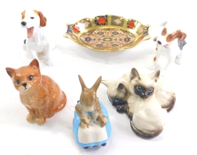 A Royal Crown Derby 1128 Imari pattern dish, of small proportion,15cm wide, Royal Doulton yawning dog, Mrs Rabbit and bunnies, Bunnykins figure, cat ornaments, etc., Beswick and others. (a quantity)