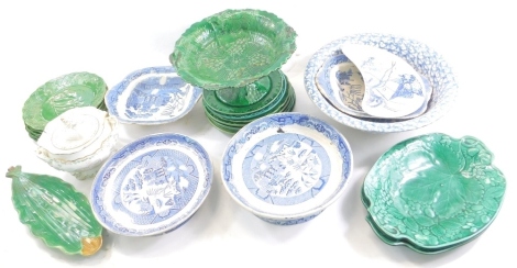 Various China and effects, various green leaf majolica ware, to include, a footed comport, 15cm high, other Wedgwood type, blue transfer printed sponge ware, wash bowl, crescent shaped blue and white dish, other blue and white pottery, unusual 19thC lidde