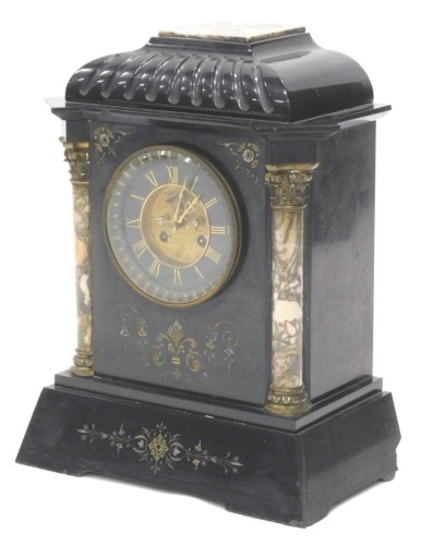 A French black slate and marble mantel clock, with a domed top, the dial with gilt Roman numerals flanked by cylindrical Corinthium columns, on a tapering base, 43cm high.