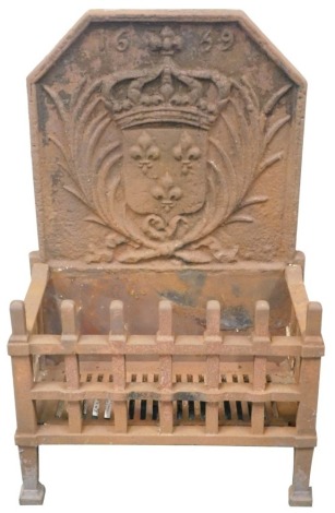 A cast iron fire basket, the fire back decorated with a crest and bearing date 1699, 82cm high, 52cm wide.