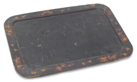 A Victorian ebonised papier mache tray, decorated in red and gilt with Oriental style flowers, birds, etc, 70cm x 50cm. (AF)