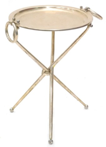 A silver plated two handled folding occasional table, on ball feet, 42cm high, the circular top 34cm diameter.