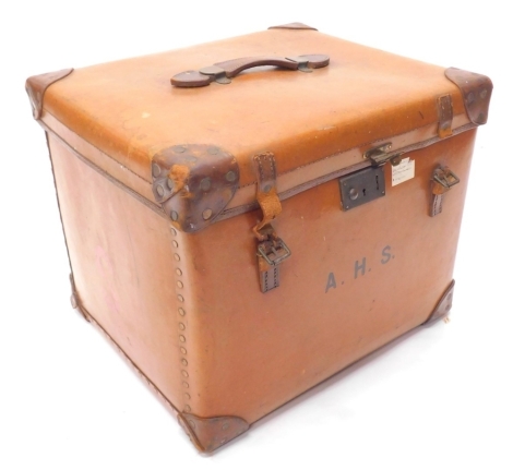 A leather and canvas trunk, label to interior for the Verlite Vulcanised Fibre Trunk, with fitted interior, the front bearing initials A.H.S, 52cm wide.