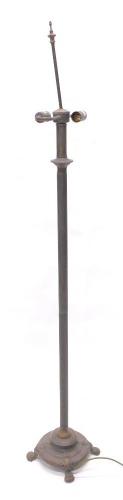A bronze effect column standard lamp, with cast feet, 152cm high.