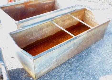 A galvanized rectangular metal animal feeder, 33cm high, 129cm wide.