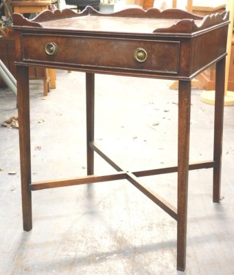 A mahogany occasional table, the rectangular top with a raised gallery above a frieze drawer on square tapering legs with X stretcher, 46cm wide.