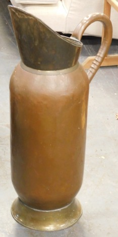 A large copper and brass stick stand or flagon, 75cm high.