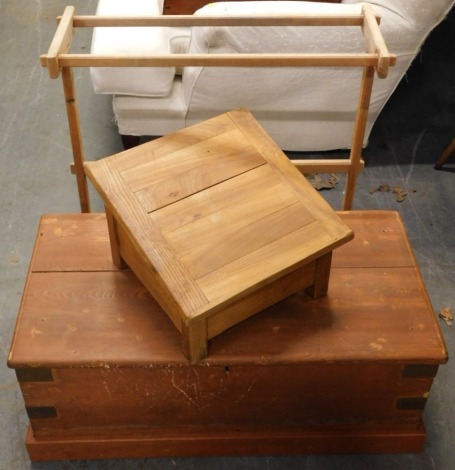 A shallow pine tool or blanket box, on a plinth base, a pine towel rail of plain form and a small elm reading stand, bearing inscription ' as a man thinketh in his heart so is he'.