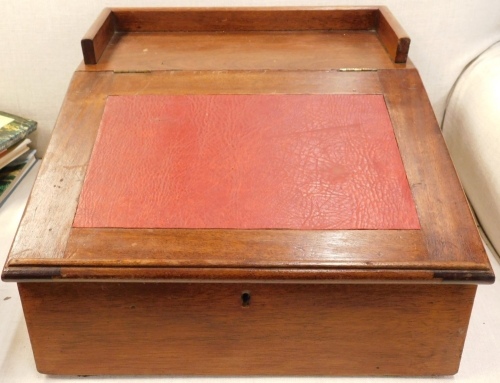 A mahogany reading stand, with a raised gallery the hinged sloped front with a red leatherette insert enclosing a vacant interior, 47cm wide.