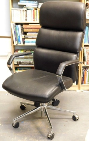 A Staples chrome and black leatherette office chair.