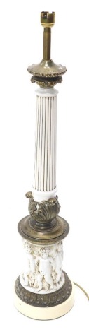 A continental composition and brass column table lamp, decorated with putti, 72cm high. (AF)