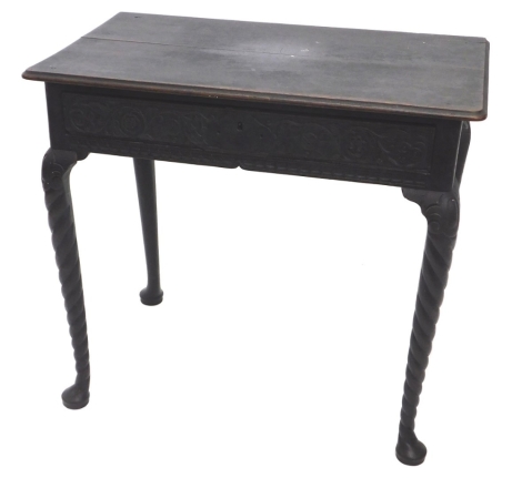 An 18thC oak side table, the rectangular top with rounded corners and moulded edge, above a frieze drawer, on cabriole legs with pad feet, the carving probably later, 71cm high, 79cm wide, 46cm deep.