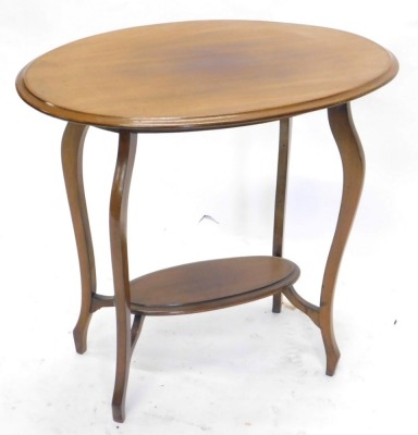 An Edwardian mahogany two tier occasional table, the top with a moulded edge, on shaped legs, 72cm high, 76cm wide.